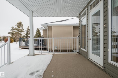 View of patio / terrace featuring a deck - 48 Fairway Point(E), Spruce Grove, AB - Outdoor With Exterior