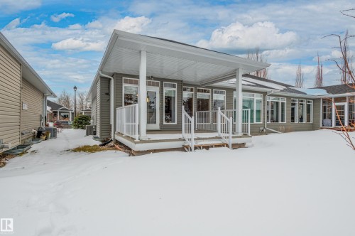 View of snow covered house - 48 Fairway Point(E), Spruce Grove, AB - Outdoor