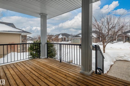 Wooden deck featuring a residential view - 48 Fairway Point(E), Spruce Grove, AB - Outdoor With Exterior
