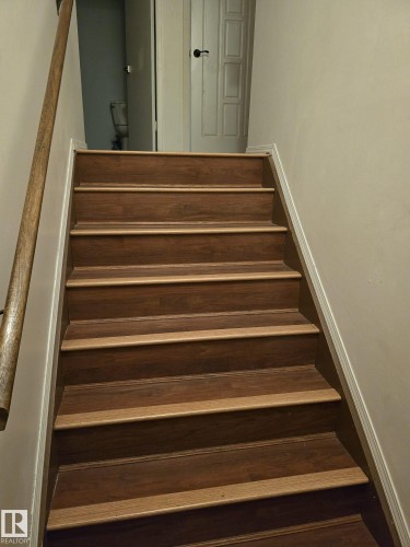 Stairway with baseboards - 11927 85 Street Nw, Edmonton, AB - Indoor Photo Showing Other Room