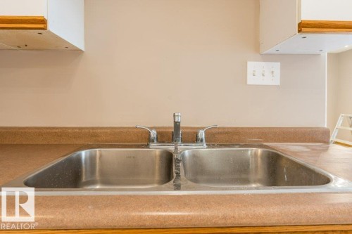 Kitchen view of a sink - 4827 54 Avenue, Wetaskiwin, AB - Indoor Photo Showing Kitchen With Double Sink