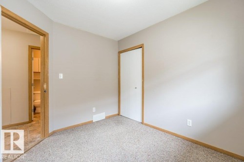 Unfurnished bedroom with a closet and light colored carpet - 4827 54 Avenue, Wetaskiwin, AB - Indoor Photo Showing Other Room
