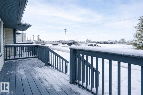 View of snow covered deck - 4827 54 Avenue, Wetaskiwin, AB - Outdoor