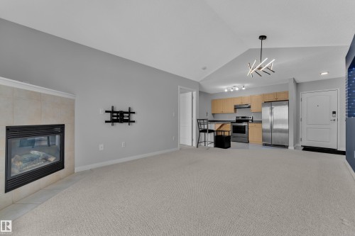 306 905 Blacklock Way, Edmonton, AB - Indoor Photo Showing Living Room With Fireplace