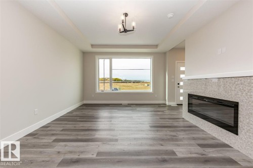 201 Caledonia Drive, Leduc, AB - Indoor With Fireplace