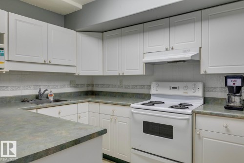 Social Room Kitchen - 110 8315 83 Street Nw, Edmonton, AB - Indoor Photo Showing Kitchen
