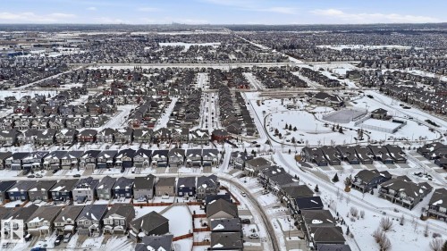 Aerial view of property and surrounding area with nearby suburban area - 8320 Mayday Link Sw, Edmonton, AB - Outdoor With View