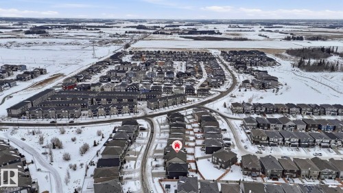 Snowy aerial view with a residential view - 8320 Mayday Link Sw, Edmonton, AB - Outdoor With View