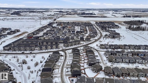 Snowy aerial view with a residential view - 8320 Mayday Link Sw, Edmonton, AB - Outdoor With View