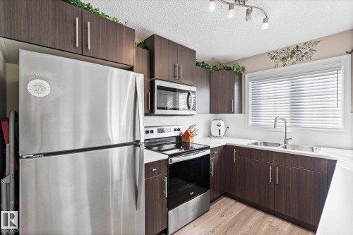 112 2208 44 Avenue, Edmonton, AB - Indoor Photo Showing Kitchen With Double Sink