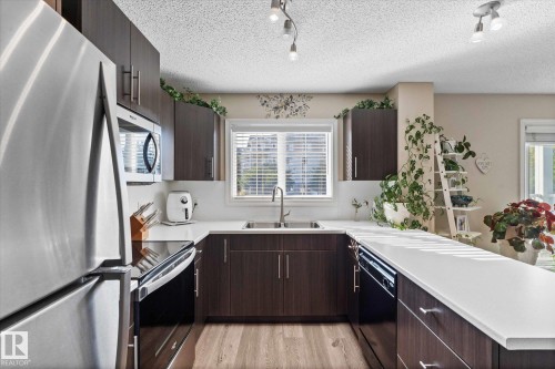 112 2208 44 Avenue, Edmonton, AB - Indoor Photo Showing Kitchen With Double Sink