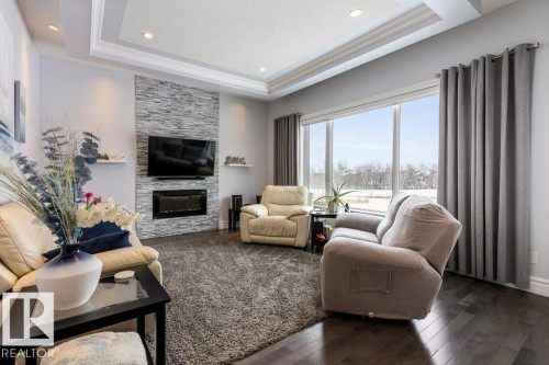 3698 Hummingbird Way, Edmonton, AB - Indoor Photo Showing Living Room With Fireplace