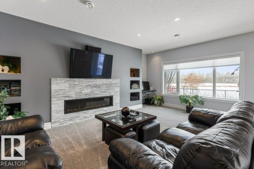 3698 Hummingbird Way, Edmonton, AB - Indoor Photo Showing Living Room With Fireplace