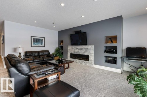 3698 Hummingbird Way, Edmonton, AB - Indoor Photo Showing Living Room With Fireplace