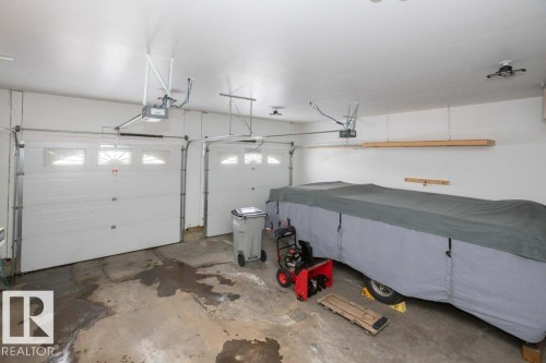 Garage with a garage door opener - 11116 103 Street, Westlock, AB - Indoor Photo Showing Garage