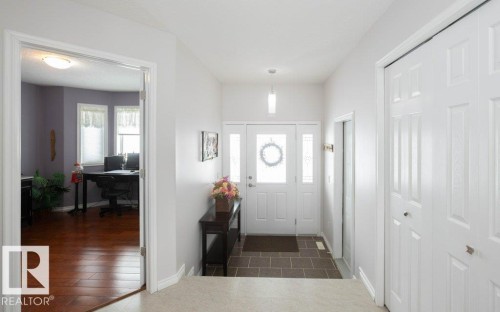 Entrance foyer with baseboards - 11116 103 Street, Westlock, AB - Indoor Photo Showing Other Room