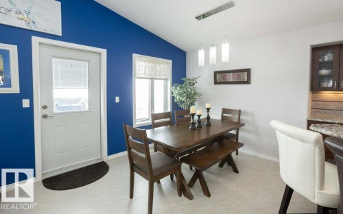 Dining space featuring lofted ceiling and light floors - 11116 103 Street, Westlock, AB - Indoor Photo Showing Dining Room