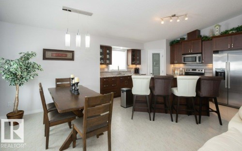 Dining area with light flooring and lofted ceiling - 11116 103 Street, Westlock, AB - Indoor Photo Showing Dining Room