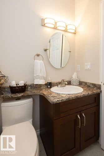 Bathroom featuring vanity and toilet - 11116 103 Street, Westlock, AB - Indoor Photo Showing Bathroom