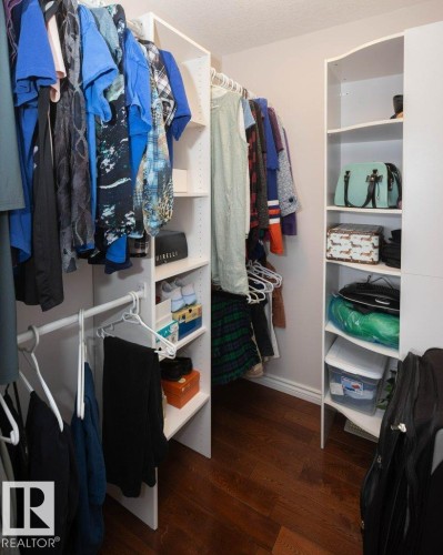 Walk in closet featuring dark wood finished floors - 11116 103 Street, Westlock, AB - Indoor With Storage