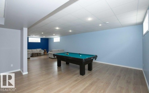 Rec room with pool table, light wood-style flooring, a paneled ceiling, and recessed lighting - 11116 103 Street, Westlock, AB - Indoor Photo Showing Other Room