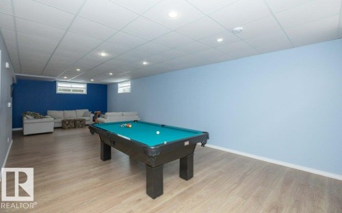 Playroom with a drop ceiling, billiards, light wood-type flooring, and recessed lighting - 11116 103 Street, Westlock, AB - Indoor Photo Showing Other Room