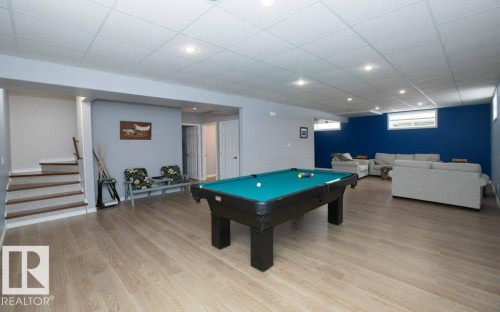 Rec room featuring a drop ceiling, pool table, light wood-type flooring, and recessed lighting - 11116 103 Street, Westlock, AB - Indoor Photo Showing Other Room
