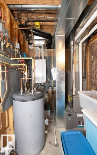Utility room with water heater - 11116 103 Street, Westlock, AB - Indoor Photo Showing Basement