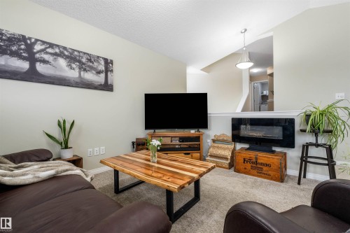 7422 Singer Landing Landing, Edmonton, AB - Indoor Photo Showing Living Room With Fireplace