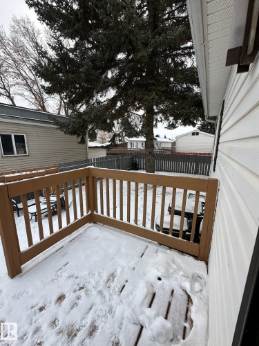 View of snow covered deck - 341 West Brook Way Nw, Edmonton, AB - Outdoor With Exterior