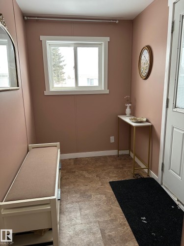 Laundry area with stone finish floors - 341 West Brook Way Nw, Edmonton, AB - Indoor Photo Showing Other Room