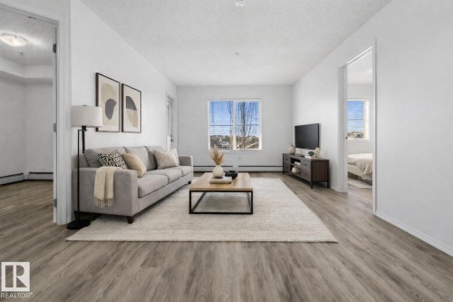 313 270 Mcconachie Drive, Edmonton, AB - Indoor Photo Showing Living Room
