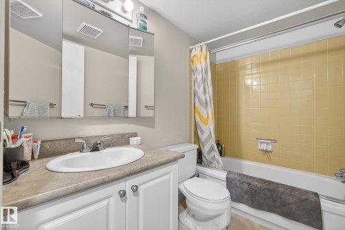 Full bath featuring vanity and shower / bath combo - 302 4608 52 Avenue, Stony Plain, AB - Indoor Photo Showing Bathroom