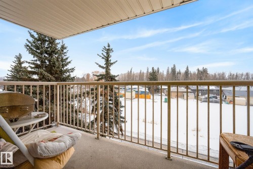 View of snow covered back of property - 302 4608 52 Avenue, Stony Plain, AB - Outdoor With Balcony With Exterior