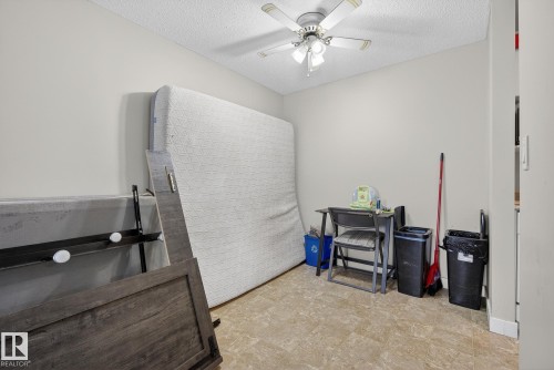 Miscellaneous room featuring a textured ceiling and ceiling fan - 307 4608 52 Avenue, Stony Plain, AB - Indoor
