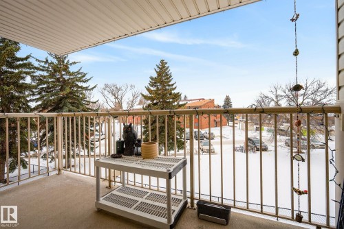 View of snow covered back of property - 307 4608 52 Avenue, Stony Plain, AB - Outdoor With Balcony With Exterior