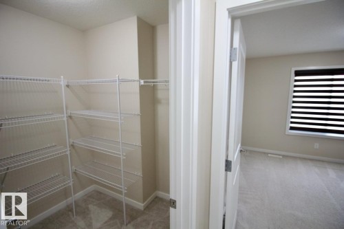 Upper 2436 Casey Link Sw, Edmonton, AB - Indoor With Storage