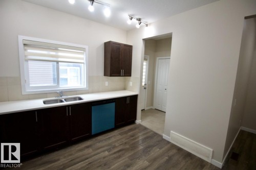 Upper 2436 Casey Link Sw, Edmonton, AB - Indoor Photo Showing Kitchen With Double Sink