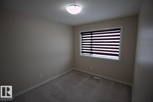 Upper 2436 Casey Link Sw, Edmonton, AB - Indoor Photo Showing Other Room