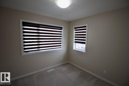 Upper 2436 Casey Link Sw, Edmonton, AB - Indoor Photo Showing Other Room