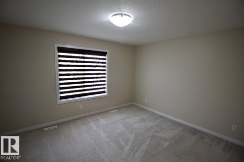 Upper 2436 Casey Link Sw, Edmonton, AB - Indoor Photo Showing Other Room