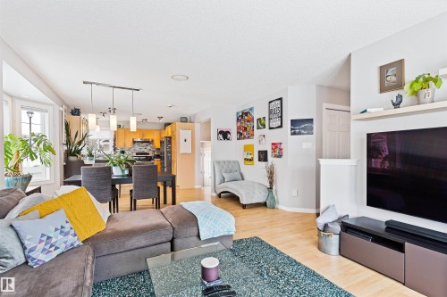 Living room featuring light wood-style floors and track lighting - 7804 Schmid Place, Edmonton, AB - Indoor Photo Showing Living Room