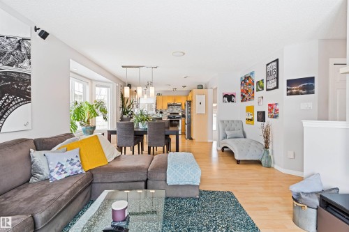Living room featuring light wood finished floors and baseboards - 7804 Schmid Place, Edmonton, AB - Indoor Photo Showing Living Room