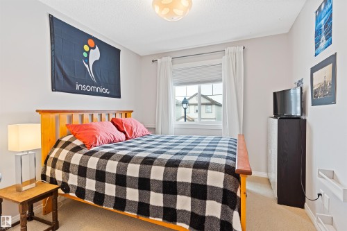 Bedroom with light carpet and a textured ceiling - 7804 Schmid Place, Edmonton, AB - Indoor Photo Showing Bedroom