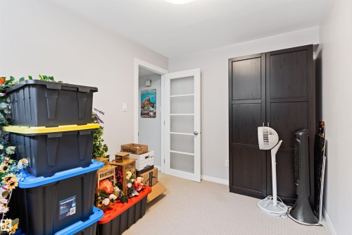 Recreation room featuring light carpet and baseboards - 7804 Schmid Place, Edmonton, AB - Indoor
