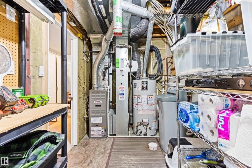 Utilities with gas water heater and heating unit - 7804 Schmid Place, Edmonton, AB - Indoor Photo Showing Basement