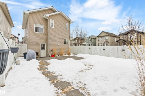 Back of house featuring a residential view and a fenced backyard - 7804 Schmid Place, Edmonton, AB - Outdoor
