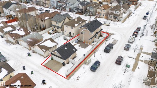 Snowy aerial view featuring property parcel outlined and a residential view - 7804 Schmid Place, Edmonton, AB - Outdoor With View