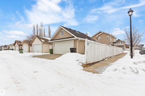Snow covered property featuring a residential view - 7804 Schmid Place, Edmonton, AB - Outdoor