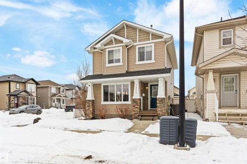 View of front of home featuring stone siding - 7804 Schmid Place, Edmonton, AB - Outdoor With Facade
